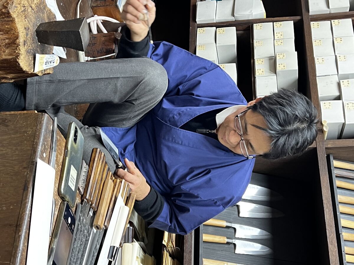 Japanese artisan knife shop with display of hand-forged knives