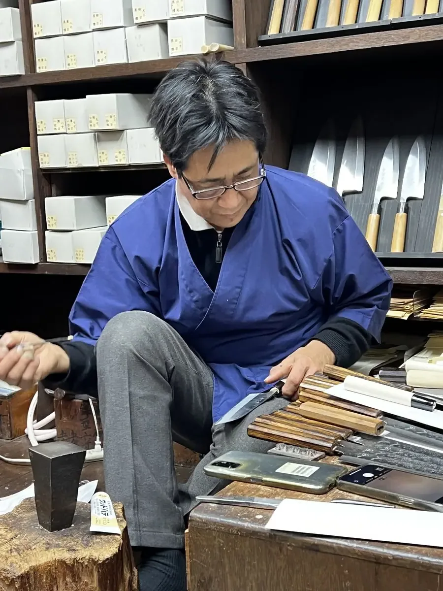 Japanese artisan knife shop with display of hand-forged knives